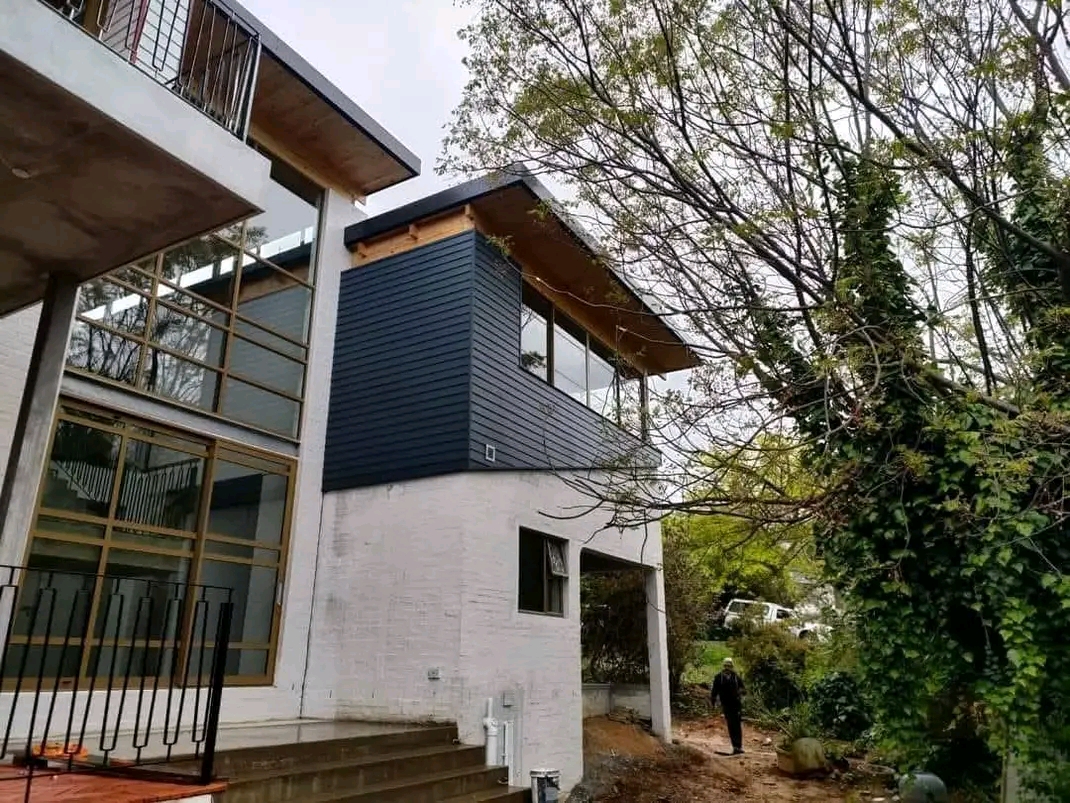 Renovated home exterior with slate siding
